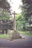 Cross on tapering plinth