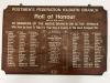 Wooden board with commemorations in white lettering