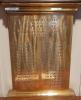 Close up of plaque set within wooden board