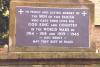 Plaque at base of cross