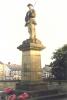 Figure of serviceman with rifle and bayonet on tapering plinth and base