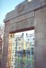 Memorial park with rectangular archway and iron gates