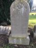 Stone family gravestone with a round top
