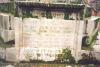 Inscription at base of cross