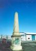 Square base, plinth and obelisk, with plaque on side of base
