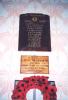Rectangular wooden plaque with inscribed name