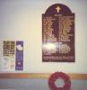 Wooden board with names painted in gold color