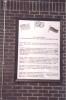 Typed, framed text with the Russian, British and American flags above the text. 