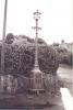 Lamp post on base with plaque inset into base