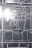 Smaller pane in a larger stained glass window