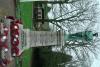Figure of serviceman atop tapering plinth