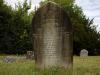 Arch-top gravestone with leaded lettering.