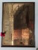 Brass plaque on wooden mount