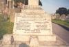 Latin cross on rectangular base with inscription