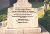 Latin cross on rectangular base with inscription