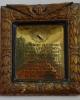 Brass plaque in ornately carved frame