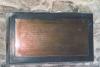 Brass plaque mounted on slate backboard