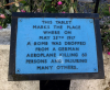 Rectangular plaque attached to mount
