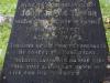Leaded lettering on blackened stone.