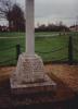 Wheel cross on tapering plinth