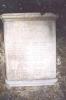 Stone tablet mounted adjacent to obelisk with lantern
