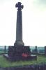 Cross on tall tapering shaft, atop base