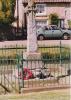 Rough cross on tapering plinth in small fenced area