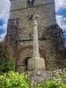 Cross with church tower in background