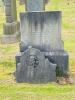 Broken stone family gravestone