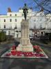 Figure of serviceman atop a pedestal with inscribed names