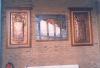 Two copper plaques set in matching wooden frames 