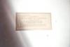 White/cream tablet with inscription