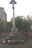 Tall calvary cross with gabled top on three steps