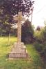 Rough hewn cross on three stepped base
