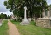 Elton war memorial cross in context from the east