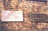 Tablet fixed to brick wall