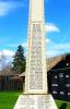 Celtic cross on tapering plinth with two stepped inscribed base