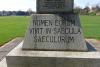 Celtic cross on tapering plinth with two stepped inscribed base