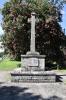 Rough hewn stone cross on stepped base