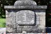 Rough hewn stone cross on stepped base