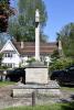 Rough hewn stone cross on stepped base