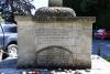 Rough hewn stone cross on stepped base