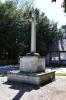 Rough hewn stone cross on stepped base
