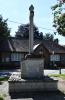 Rough hewn stone cross on stepped base