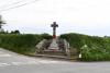 Cross on stepped base surround by semi circle of stones