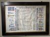 Colorful roll of honour in dark wooden frame