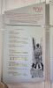 A modern, laminated, hanging display Roll of Honour with a brief history of WW1, the names and biographies of the men from the parish who died and the image of a soldier in the trenches.