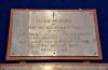 Three brass plaques mounted on wooden backboards