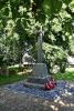 Cross on tapering plinth with inscription