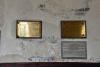 Wall mounted brass plaque on wooden board